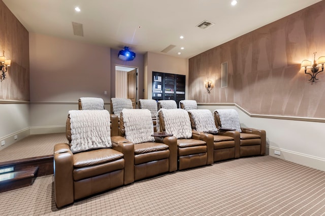 home theater room featuring light colored carpet