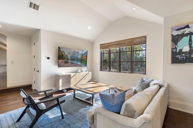 living room with lofted ceiling and dark wood-type flooring