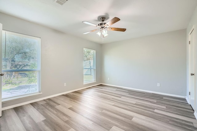 unfurnished room featuring ceiling fan and light hardwood / wood-style floors