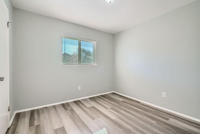 empty room with light hardwood / wood-style floors