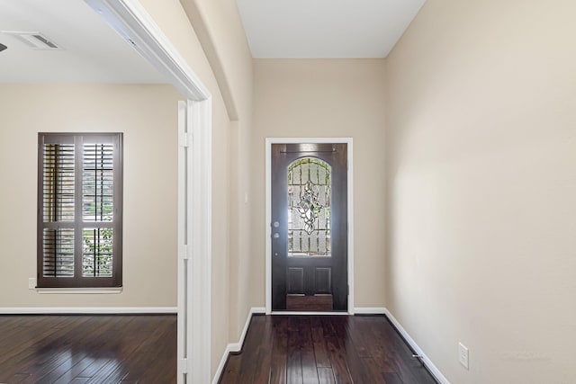 entryway with dark hardwood / wood-style floors