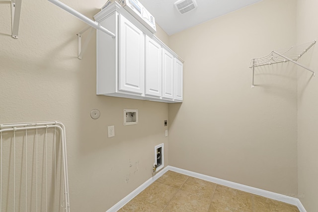 laundry room with electric dryer hookup, hookup for a washing machine, cabinets, and gas dryer hookup