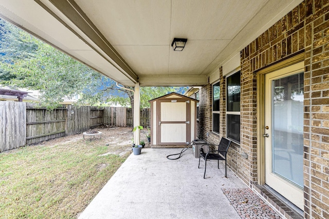 view of patio / terrace with a shed