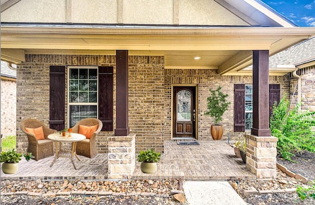 25209 Quiet Ledge, Porter, TX 77365 - view of exterior entry featuring covered porch and brick siding