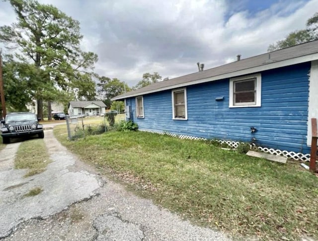 view of property exterior featuring a yard