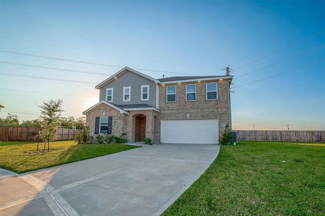 view of front of home featuring a garage and a front lawn