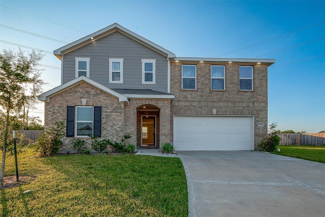 view of front of house with a front yard and a garage