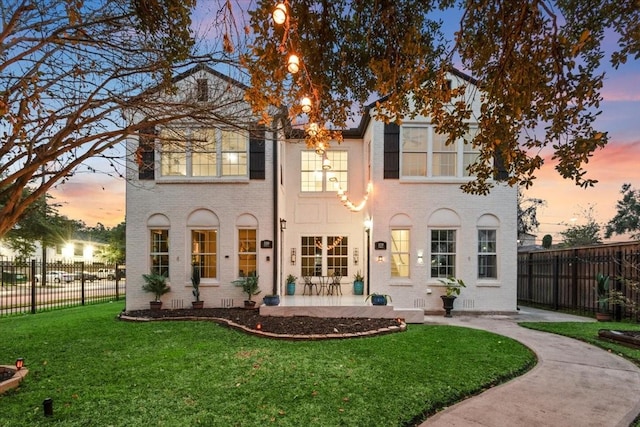 view of front of house with a lawn