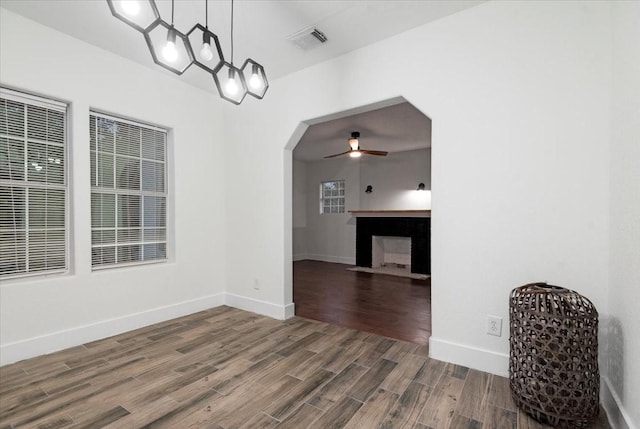 unfurnished dining area featuring ceiling fan