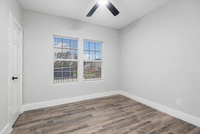 spare room featuring hardwood / wood-style flooring and ceiling fan