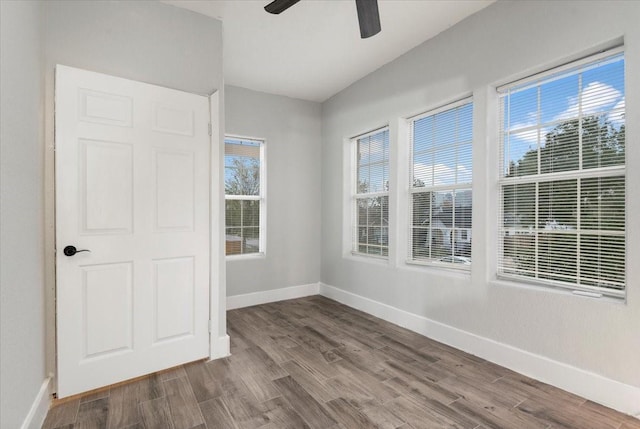 empty room with wood-type flooring and ceiling fan