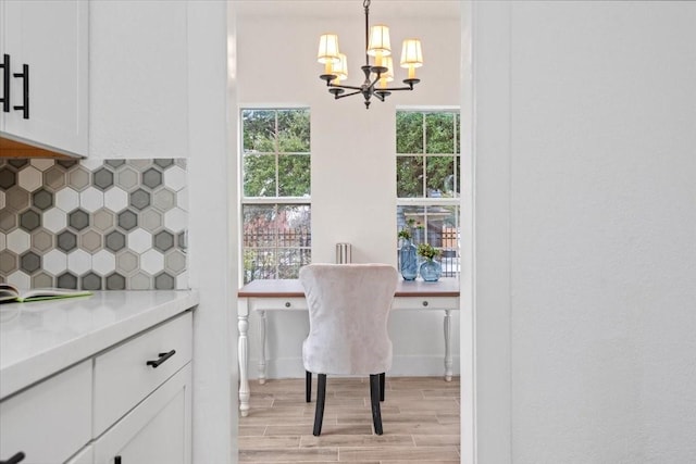 dining space featuring a chandelier and light hardwood / wood-style flooring