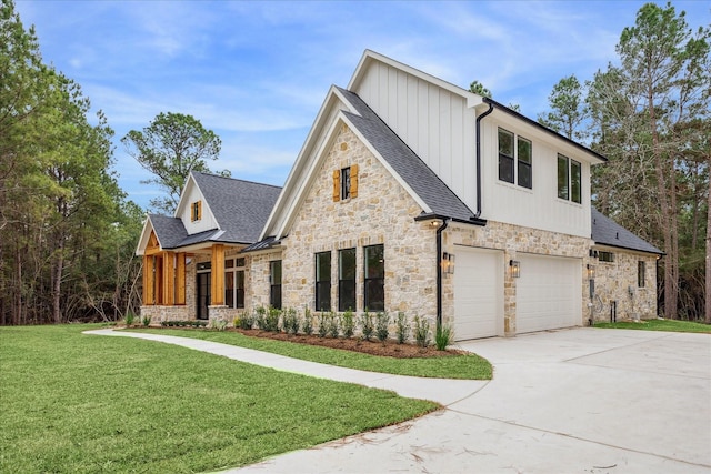 view of front of house with a front yard and a garage