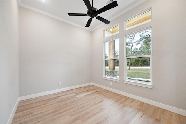 empty room featuring ceiling fan, crown molding, light hardwood / wood-style floors, and plenty of natural light