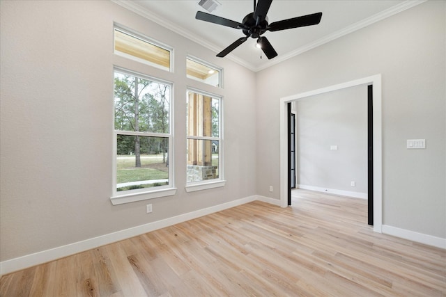 empty room with light hardwood / wood-style floors, crown molding, and ceiling fan