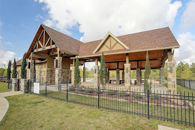 11502 Kate Ct, Montgomery, TX 77316 - view of front facade featuring roof with shingles and stone siding