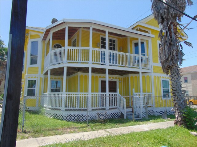 view of front facade featuring a balcony and covered porch