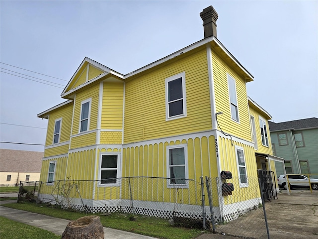 view of side of home with a chimney