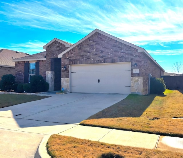 view of front facade with a front yard and a garage