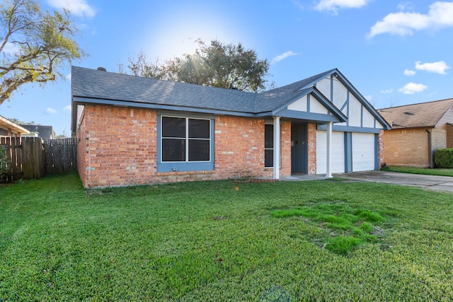 view of front facade with a front yard and a garage