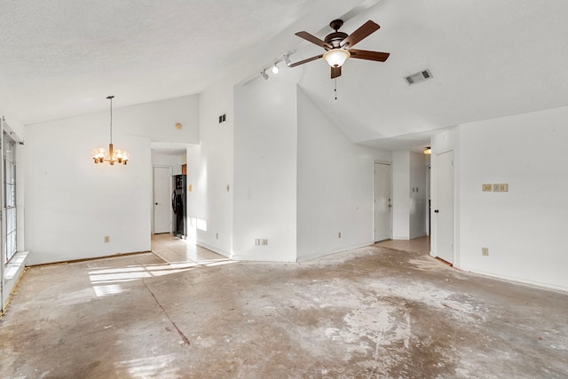 unfurnished living room with vaulted ceiling, ceiling fan with notable chandelier, track lighting, and a textured ceiling