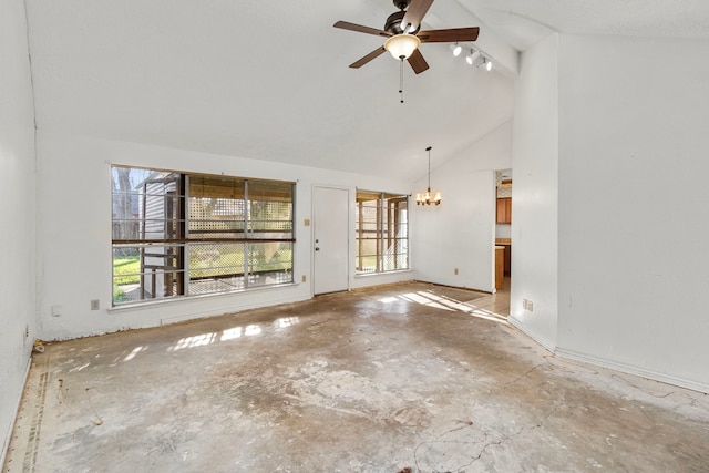 unfurnished living room with a healthy amount of sunlight, ceiling fan with notable chandelier, and high vaulted ceiling