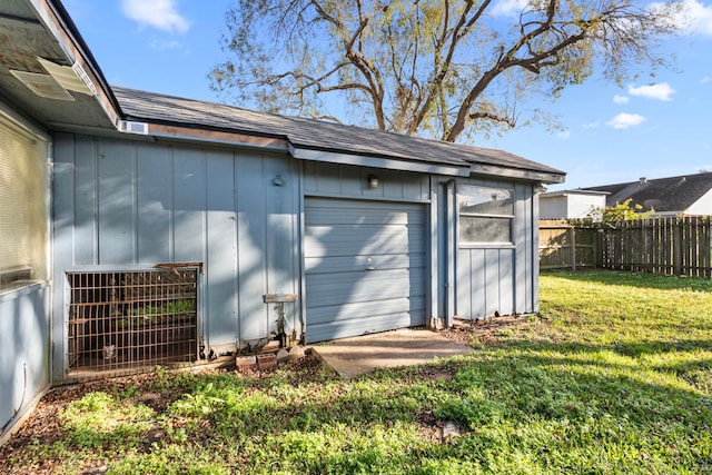 garage featuring a yard