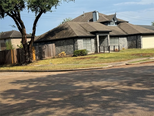 view of home's exterior with a lawn