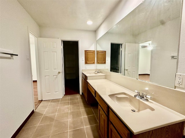 bathroom featuring tile patterned floors and vanity