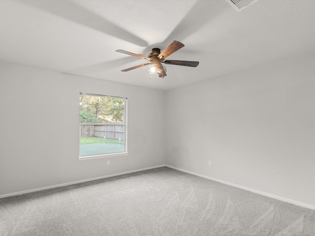 spare room with ceiling fan and carpet flooring