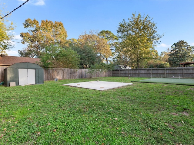 view of yard featuring a patio area and a shed