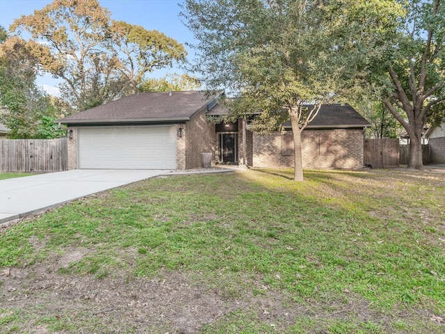 ranch-style house with a front yard and a garage