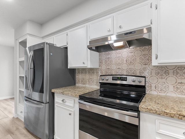 kitchen with light stone countertops, decorative backsplash, white cabinetry, and appliances with stainless steel finishes