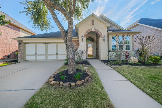 view of front facade with a front yard and a garage