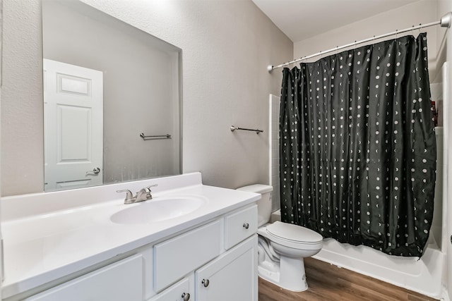 full bathroom featuring shower / tub combo, toilet, vanity, and hardwood / wood-style flooring