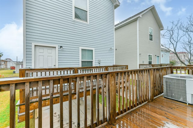 wooden terrace featuring central air condition unit