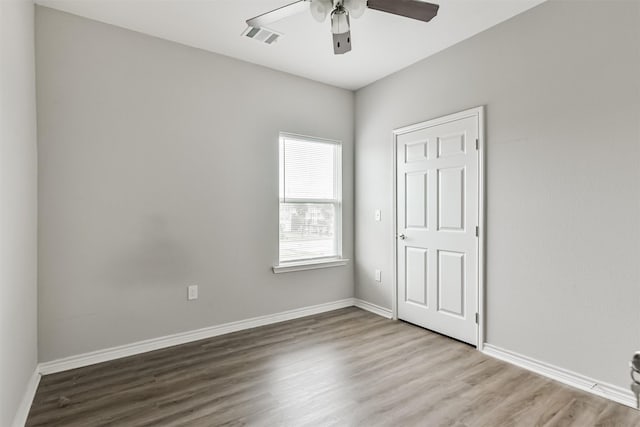 unfurnished bedroom featuring ceiling fan and light wood-type flooring