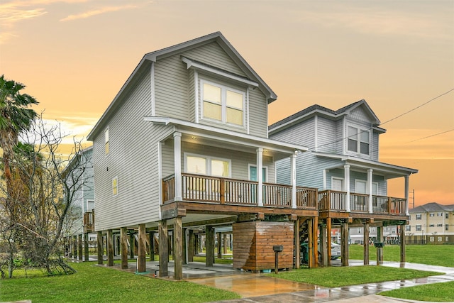 view of front of home featuring a carport and a yard