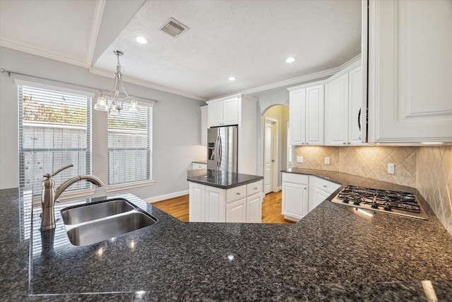 kitchen featuring sink, white cabinets, and appliances with stainless steel finishes