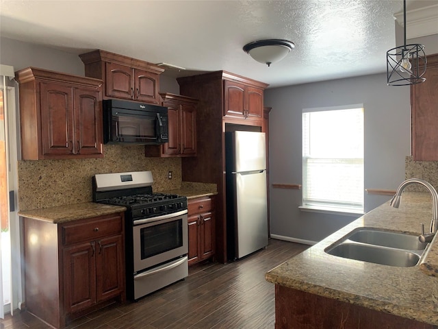 kitchen with sink, stainless steel appliances, dark hardwood / wood-style flooring, and decorative backsplash