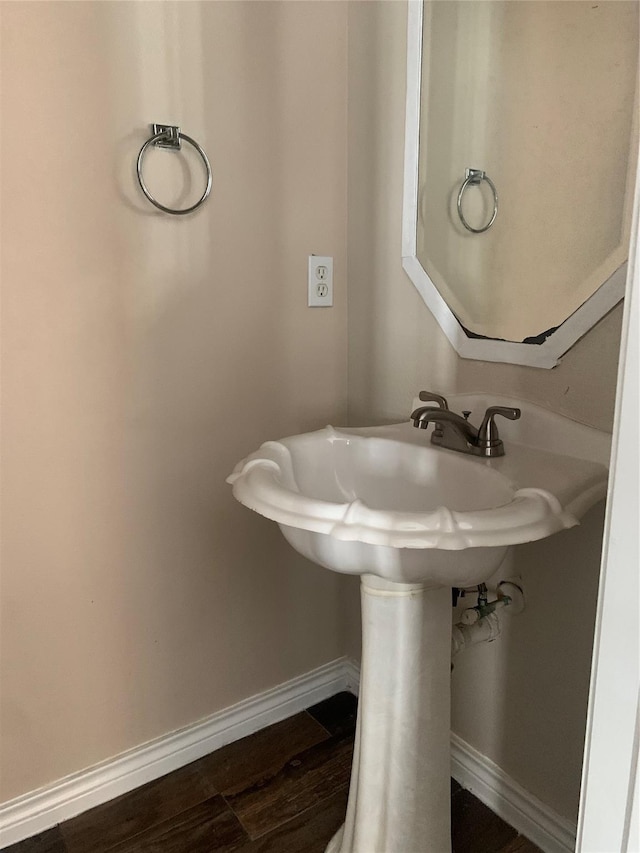 bathroom with hardwood / wood-style floors