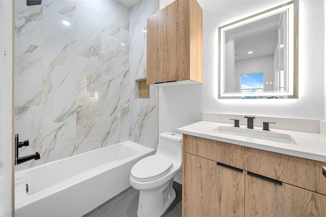 full bathroom featuring toilet, vanity, tile patterned flooring, and tiled shower / bath combo