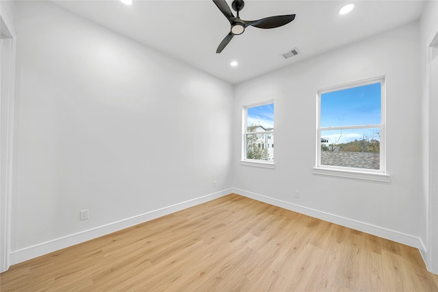 spare room with ceiling fan and light hardwood / wood-style flooring