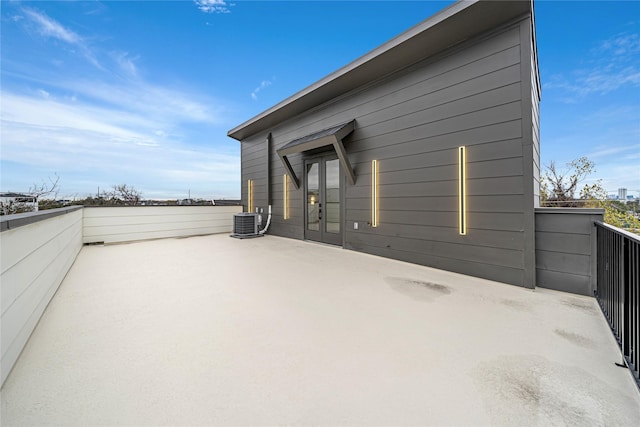 exterior space featuring french doors and central air condition unit