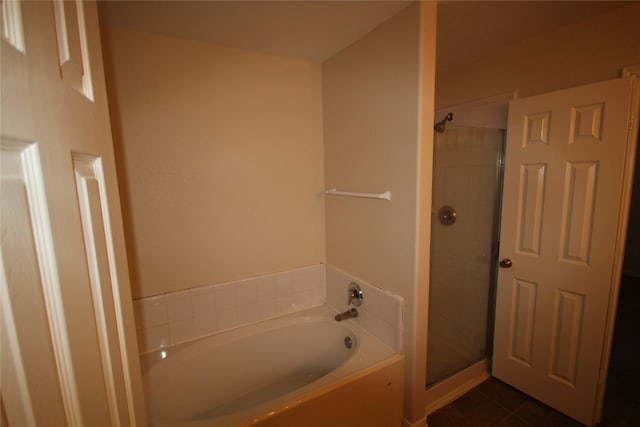 bathroom featuring plus walk in shower and tile patterned floors