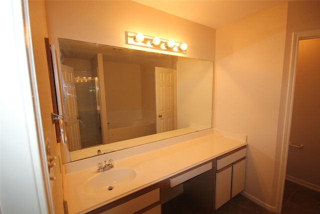 bathroom featuring plus walk in shower and vanity