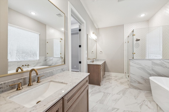 bathroom with independent shower and bath and vanity