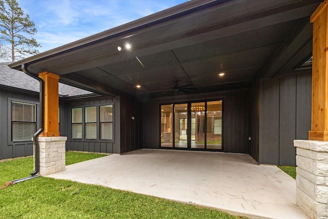 exterior space featuring ceiling fan, a patio area, and a yard