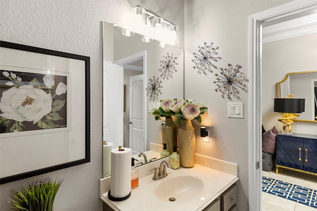 bathroom with tile patterned flooring and vanity