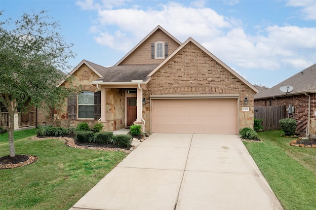 view of front of house featuring a garage and a front lawn